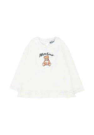 Biała koszula z długim rękawem z falbaniastym dołem, z grafikiem misia i napisem "Moschino" w czerni nad wzorem.