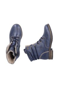 Bottines bleu marine en cuir avec un intérieur doux et doublé de fourrure. Présentent un devant à lacets, une fermeture éclair et une couture décorative sur les côtés.