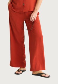 GINI LONDON - WIDE LEG - Tracksuit bottoms - mottled_orange Thumbnail Image 1