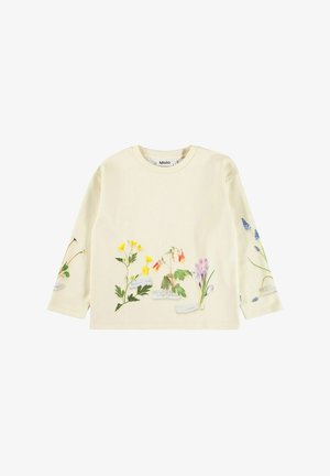 Camicia a maniche lunghe di colore crema con stampe floreali e etichette. Materiale in cotone morbido, vestibilità comoda, scollatura rotonda, colori vivaci di giallo, rosa e blu.