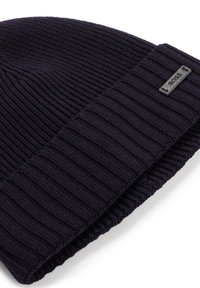 Berretto di lana navy con texture a coste e risvolto piegato. Presenta un piccolo etichetta in tessuto con testo impresso.