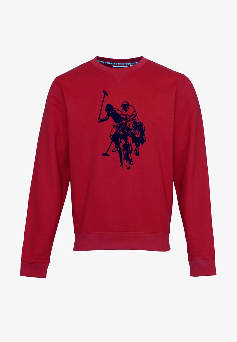 Červená mikina s kulatým výstřihem, zobrazující grafiku modrého polo hráče na koni. Měkký materiál, dlouhé rukávy a žebrované manžety.