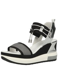 Black and silver wedge sandals featuring mesh detailing, adjustable strap, rubber sole, and a cushioned insole for comfort.