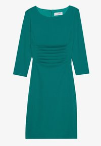 Robes teal jusqu'aux genoux avec des manches trois-quarts, dotées d'un col rond et d'une texture froncée à l'avant. Fermeture éclair au dos.