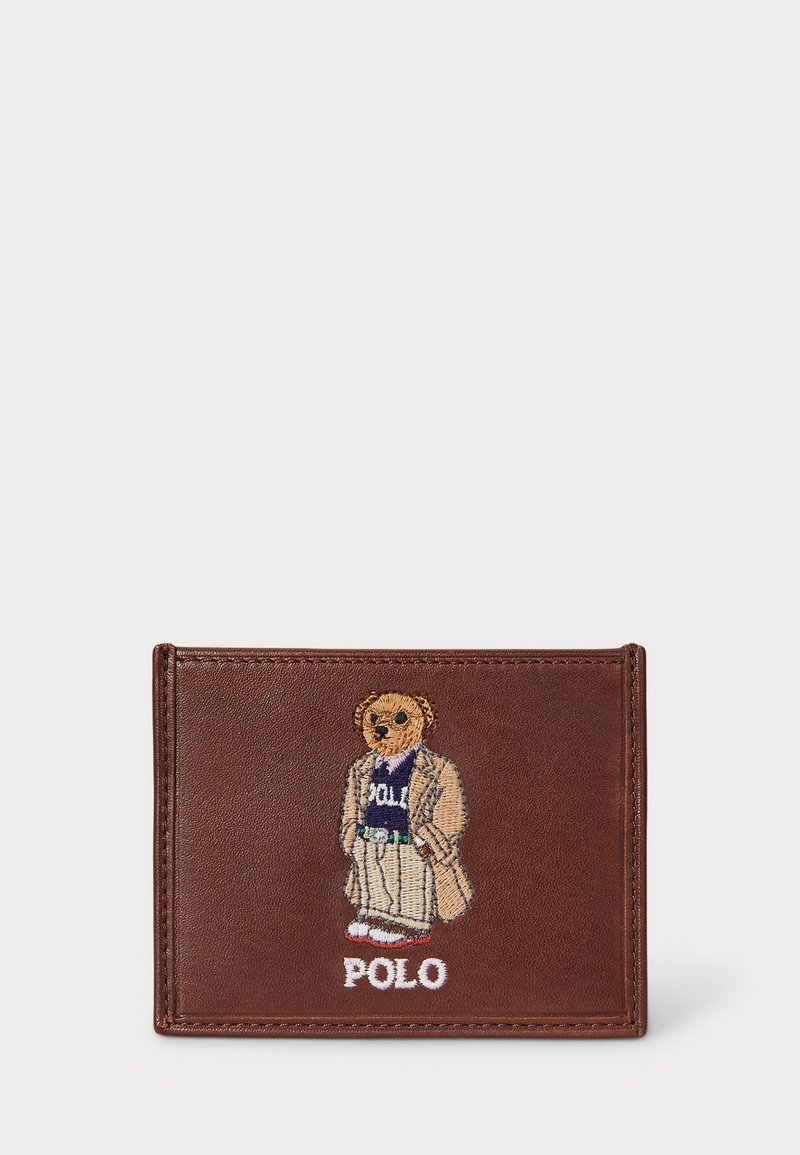 Brown leather wallet featuring an embroidered bear wearing a suit, with "POLO" text beneath the design. Smooth texture with clear stitching.