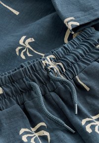 Next CHARACTER SET REGULAR FIT - Tracksuit bottoms - navy blue palms
