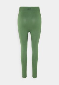 Green high-waisted seamless leggings with ribbed cuffs and a small black semi-circle logo at the back waistband.