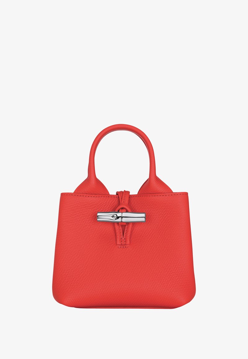 Red textured leather handbag with rounded handles and a silver horizontal clasp closure at the front center.