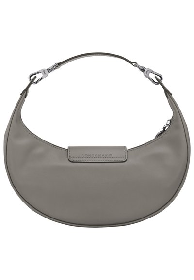 Grey leather handbag with a curved shape, featuring a flat strap and a logo-embossed tab. Metal hardware accents complete the design.