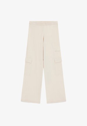 Vida byxorna i beige med vid benpassform, elastisk midja och stora ficklock på varje sida.
