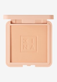 Compact de poudre pressée en plastique doux pêche. Texture lisse avec logo en relief, forme carrée et fermeture à pression sécurisée.