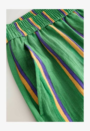 Green fabric with elastic waistband featuring vertical purple and yellow stripes and a side pocket.