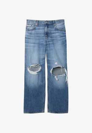 Μπλε τζιν παντελόνια με μεγάλα σκισίματα και στις δύο γόνατες και μια μικρή ετικέτα Calvin Klein στην δεξιά μπροστινή τσέπη.