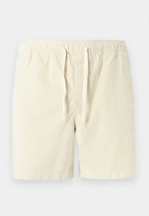 Μπεζ βερμούδα από κορδούρα με ελαστική μέση και κορδόνι μπροστά, σχεδιασμένη για casual χρήση.