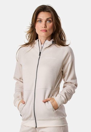 Ljusbeige zip-up huvtröja med fodrad huva, framfickor, ribbade ärmslut och en subtil logotyp på bröstet. Tillverkad av ett mjukt, elastiskt tyg.