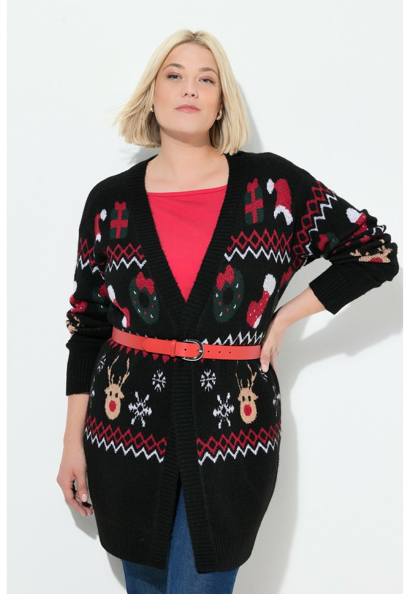 Schwarzer Strickcardigan mit Feiertagsmotiven, darunter Schneeflocken, Rentiere und Zuckerstangen, akzentuiert mit einem roten Gürtel, der in der Taille cinched.