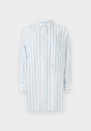 Camicia bianca con strisce verticali blu, maniche lunghe, chiusura a bottoni e due tasche sul petto. Realizzata in tessuto leggero.