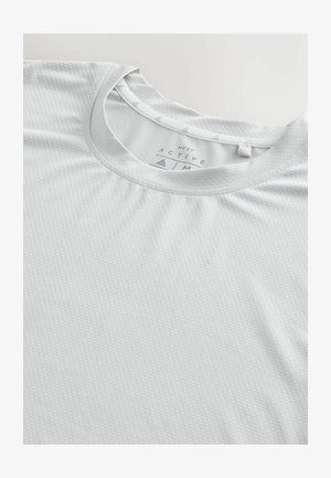 Lichtgrijze sport T-shirt gemaakt van een gestructureerde stof, met een ronde halslijn en subtiele driehoekige accenten op de kraag.