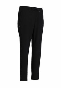Svarta joggarebyxor i mjukt material, med dragsko i midjan, sidofickor, avsmalnande ben och en slät yta.