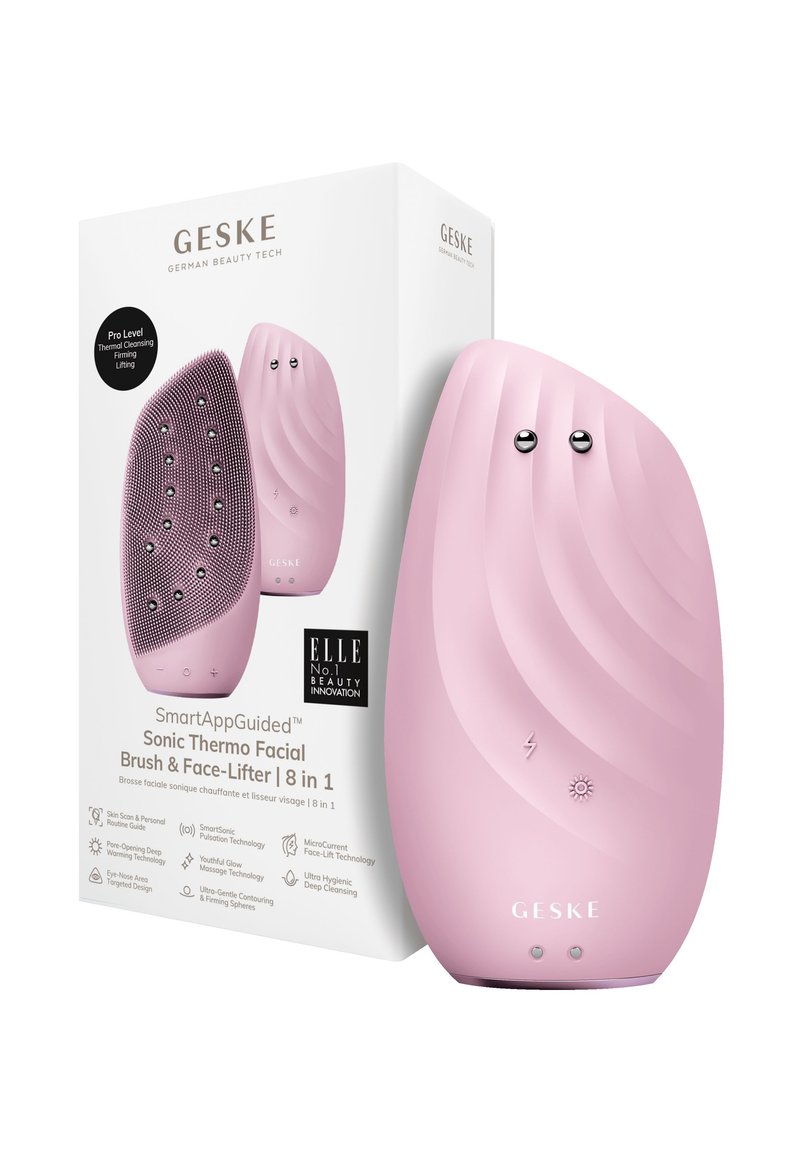 Brosse faciale Sonic rose avec une texture ondulée, des accents métalliques ronds et des icônes de contrôle. Livrée dans une boîte en carton blanc avec logo.