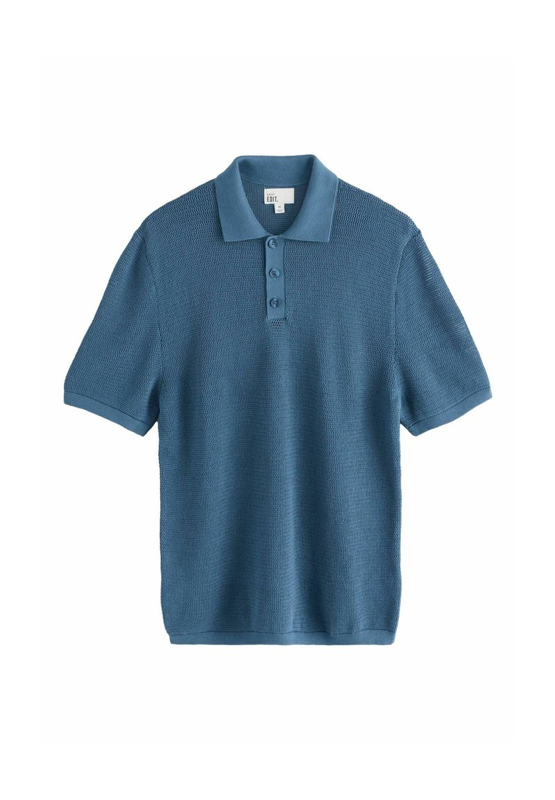 Kortærmet polo-shirt i struktureret blåt stof. Har en krave med tre knapper og en afslappet pasform.