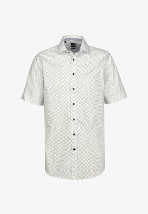 Camicia bianca a maniche corte con pois blu navy, colletto button-down e bottoni blu navy. Presenta una tasca sul lato sinistro.