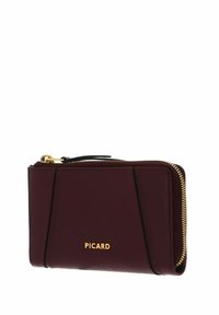 Portefeuille en cuir bordeaux avec finition texturée, fermeture éclair dorée et nom de la marque "PICARD" embossé en or sur le devant.