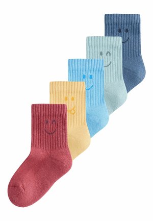 Set of five ribbed socks featuring smiley face designs. Colors include deep red, yellow, light blue, greenish-blue, and dark blue.