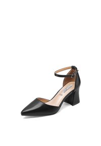 Scarpa nera in pelle con tacco alto, punta affilata, cinturino alla caviglia e tacco a blocco. L'interno presenta una fodera beige liscia con dettagli del marchio.