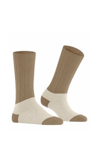 Braune gerippte Socken mit einem cremefarbenen Bund sowie Zehen- und Fersenakzenten. Weiche Textur, mittlere Höhe und lässiges Design.