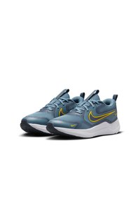 Nike running shoes in teal mesh with yellow swoosh, white midsole, and textured black rubber outsole. Features laces and pull tab.