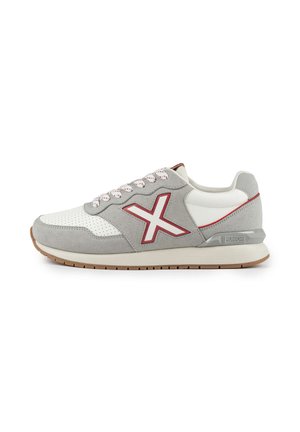 Gray suede and white leather sneaker featuring red accents, textured rubber sole, perforated toe box, and contrasting laces.
