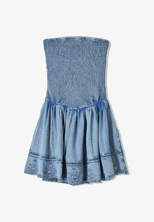 Denim strapless dress with a smocked bodice, flared tiered skirt, and embroidered floral hem in varying shades of blue.