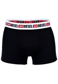 Schwarze Boxershorts mit einem weißen Bund, der mit roten und schwarzen "DIESEL"-Markierungen versehen ist. Sie sind aus weichem, elastischem Stoff gefertigt, der Komfort bietet.