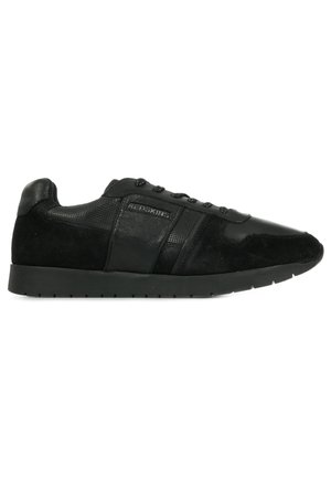 Black sneakers featuring a mix of smooth leather and textured suede, slim design, round toe, and raised black rubber sole.