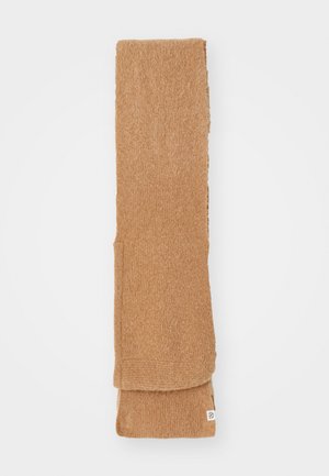 Brown knitted scarf made of soft fiber, rectangular shape, featuring a folded edge and small tag at one end.