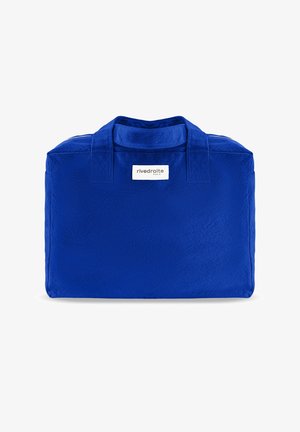 Sac fourre-tout en tissu bleu vif avec deux anses et une étiquette blanche portant l'inscription « rivedroite Paris » centrée sous les anses.