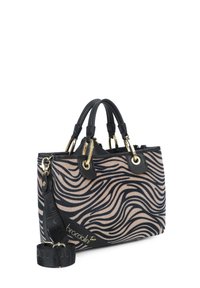 Borsa nera e beige con un motivo ondulato, hardware dorato, doppi manici e una tracolla nera staccabile.