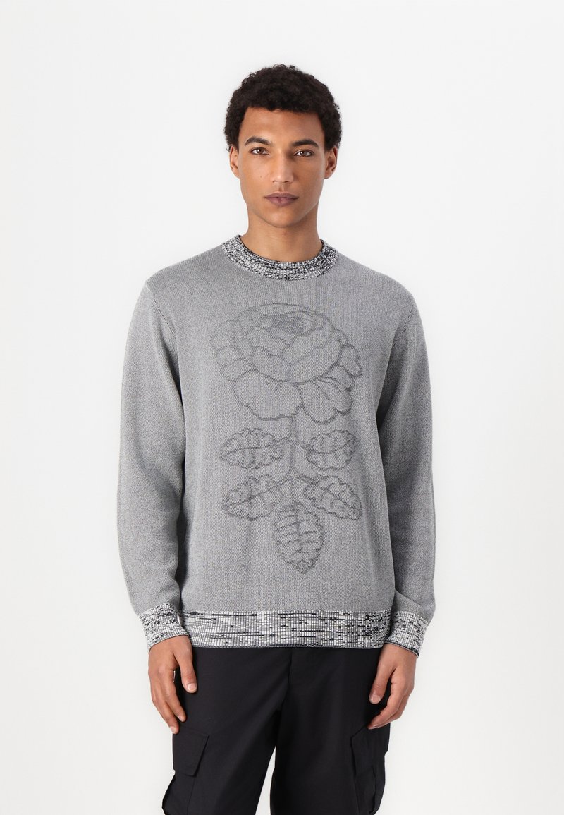 Gray knitted sweater featuring a large rose design on the front, textured black and white patterned trim at the cuffs and hem.