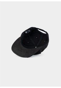 Black cap with a textured exterior, curved brim, and six vent holes. The inside features a woven label and a soft lining.