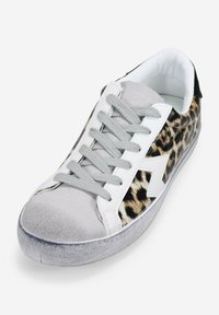 Leopard print sneaker with gray suede toe, white leather accents, and gray laces. Features textured side panel and rubber sole.