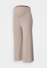 Pantalons côtelés brun clair avec une large ceinture élastique. Le tissu semble doux et présente une coupe décontractée avec des jambes évasées.