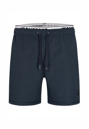 Pantaloni da mare blu navy con elastico in vita e cordino, caratterizzati da una banda logo a contrasto e un piccolo patch logo nero.