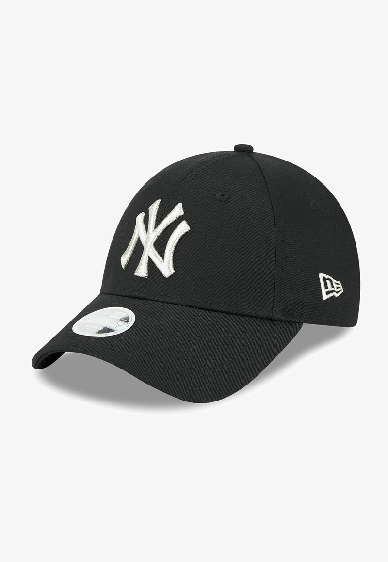 Black baseball cap with a raised white embroidered New York Yankees logo on the front, and a flat brim with a round New Era sticker on the side.