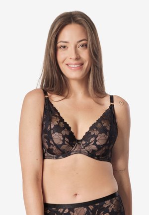 - Biustonosz z trójkątną miseczką