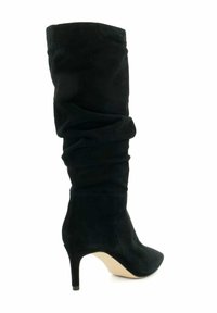 Black suede knee-high boot with slouchy design, pointed toe, and a moderate stiletto heel. Smooth texture and unembellished surface.