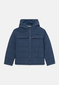 Tengerészkék steppelt dzseki kapucnival, két elülső zsebbel, cipzáros záródással és puha belső béléssel. "Levi's" logó a mellrészen.