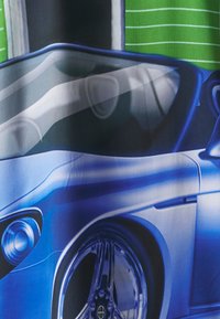 Blue sports car with a sleek design, shiny alloy wheels, and a curvy silhouette. Background features green lines and a dark surface.