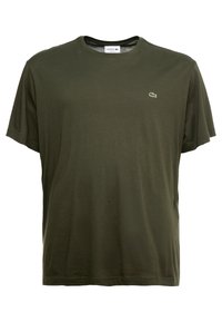 T-shirt a manica corta color verde oliva di Lacoste con colletto rotondo e piccolo logo coccodrillo sul lato sinistro del petto.