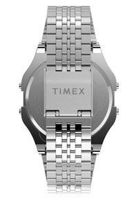 Silver stainless steel watch with a textured metal bracelet, square case, Timex branding on the back, and water-resistant marking.